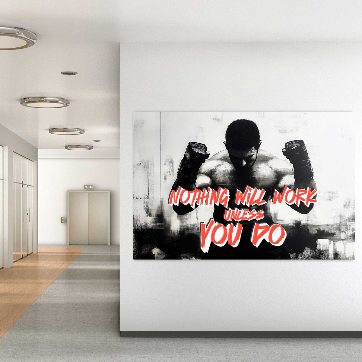 A black-and-white wall art print of a muscular boxer with clenched fists, accompanied by the motivational text "Nothing Will Work Unless You Do."