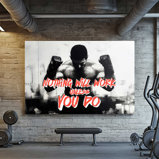 A black-and-white wall art print of a muscular boxer with clenched fists, accompanied by the motivational text "Nothing Will Work Unless You Do."