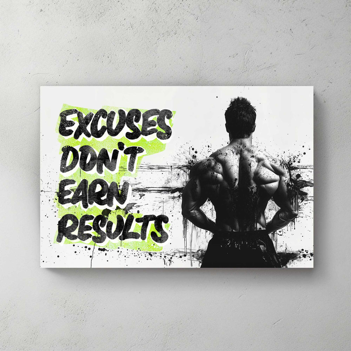 A black-and-white wall art print of a bodybuilder’s back with bold text reading "Excuses Don’t Earn Results," surrounded by ink splatter for a dramatic effect.