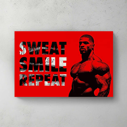 A metal print of a muscular figure on a bright red background with the text "Sweat Smile Repeat" in bold black-and-white typography.