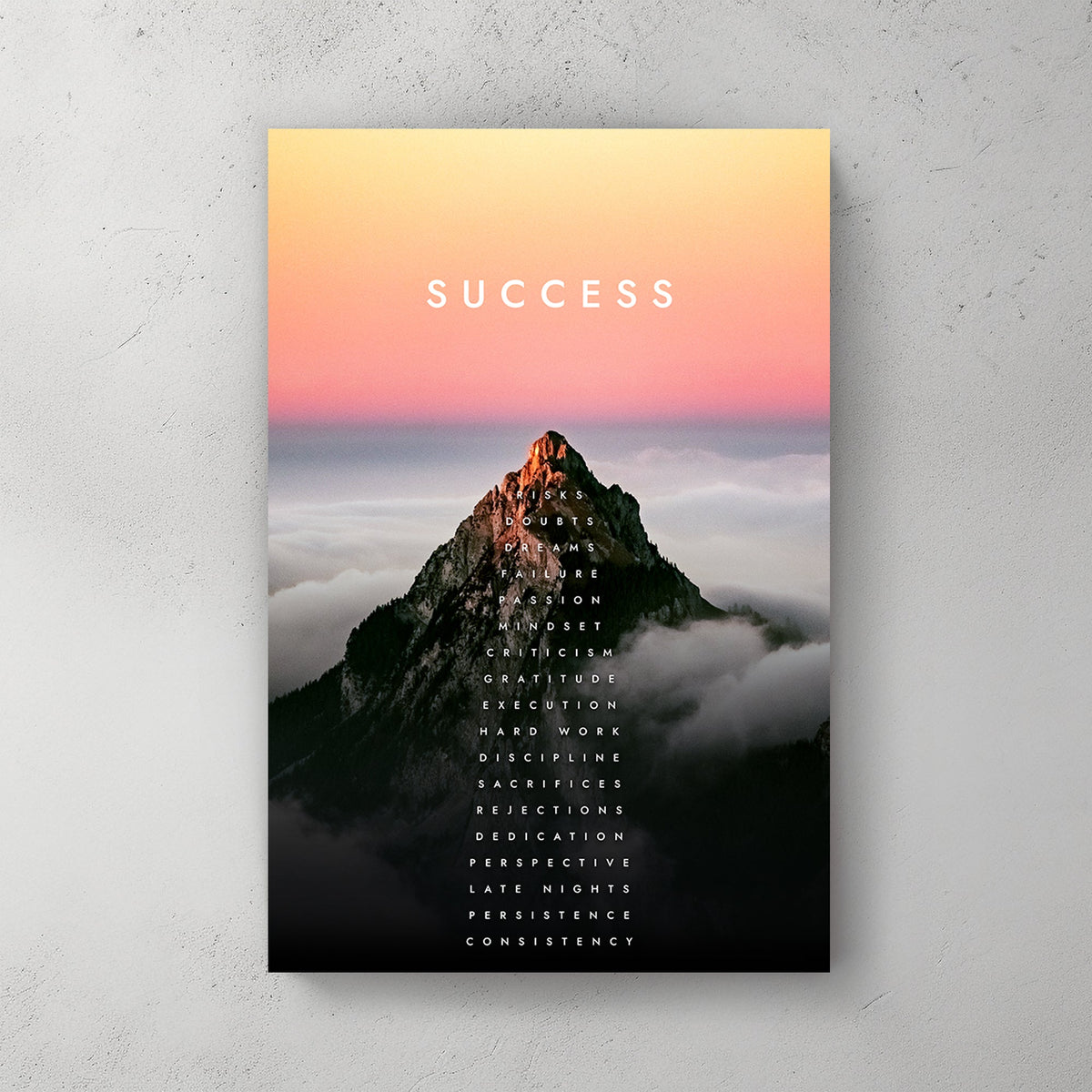 A motivational metal print of a glowing mountain peak at sunrise with the word "SUCCESS" and a vertical list of motivational attributes climbing the mountain.