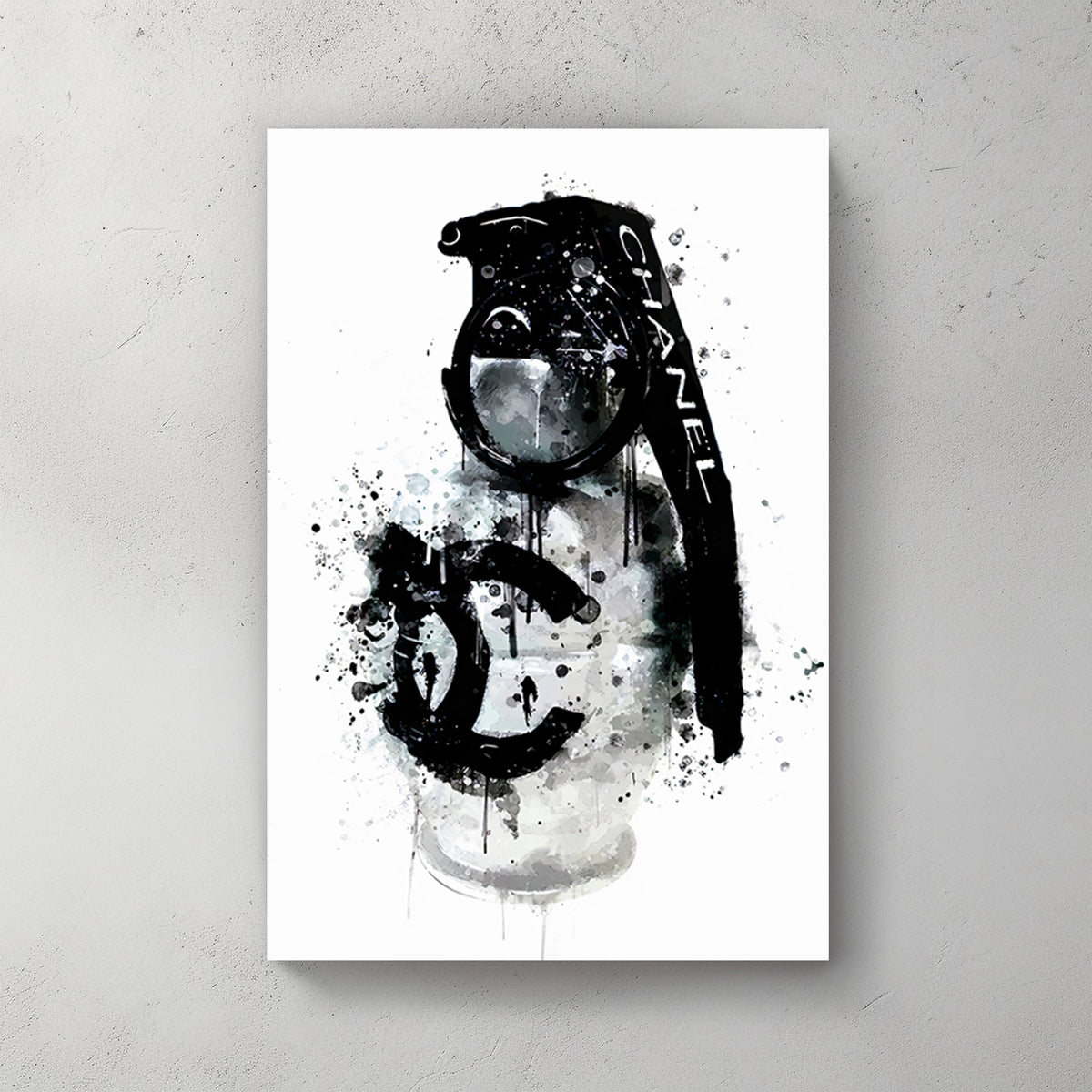 A wall art print of a Chanel branded grenade dripping with black ink splatters on a white background, combining luxury and chaos.