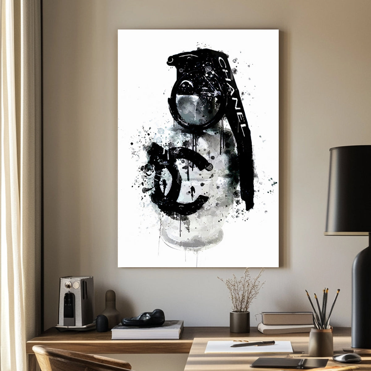 A wall art print of a Chanel branded grenade dripping with black ink splatters on a white background, combining luxury and chaos.