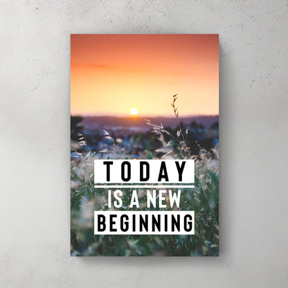 A motivational wall art print of a calming sunrise over a green field, with the words "Today is a New Beginning" overlaid on the scene.