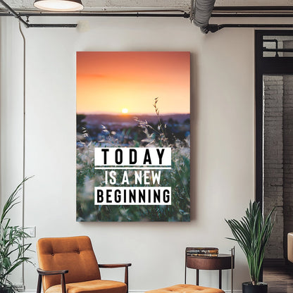 A motivational wall art print of a calming sunrise over a green field, with the words "Today is a New Beginning" overlaid on the scene.