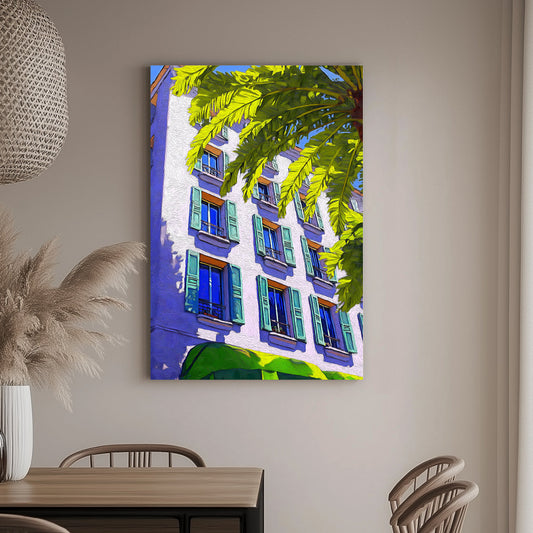 Brightly coloured wall art print of a Mediterranean-style building with green shutters and a palm tree, set against a vivid blue sky.