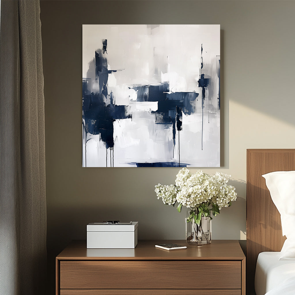 Abstract wall artwork featuring bold navy and white brushstrokes with dripped accents on a textured background.