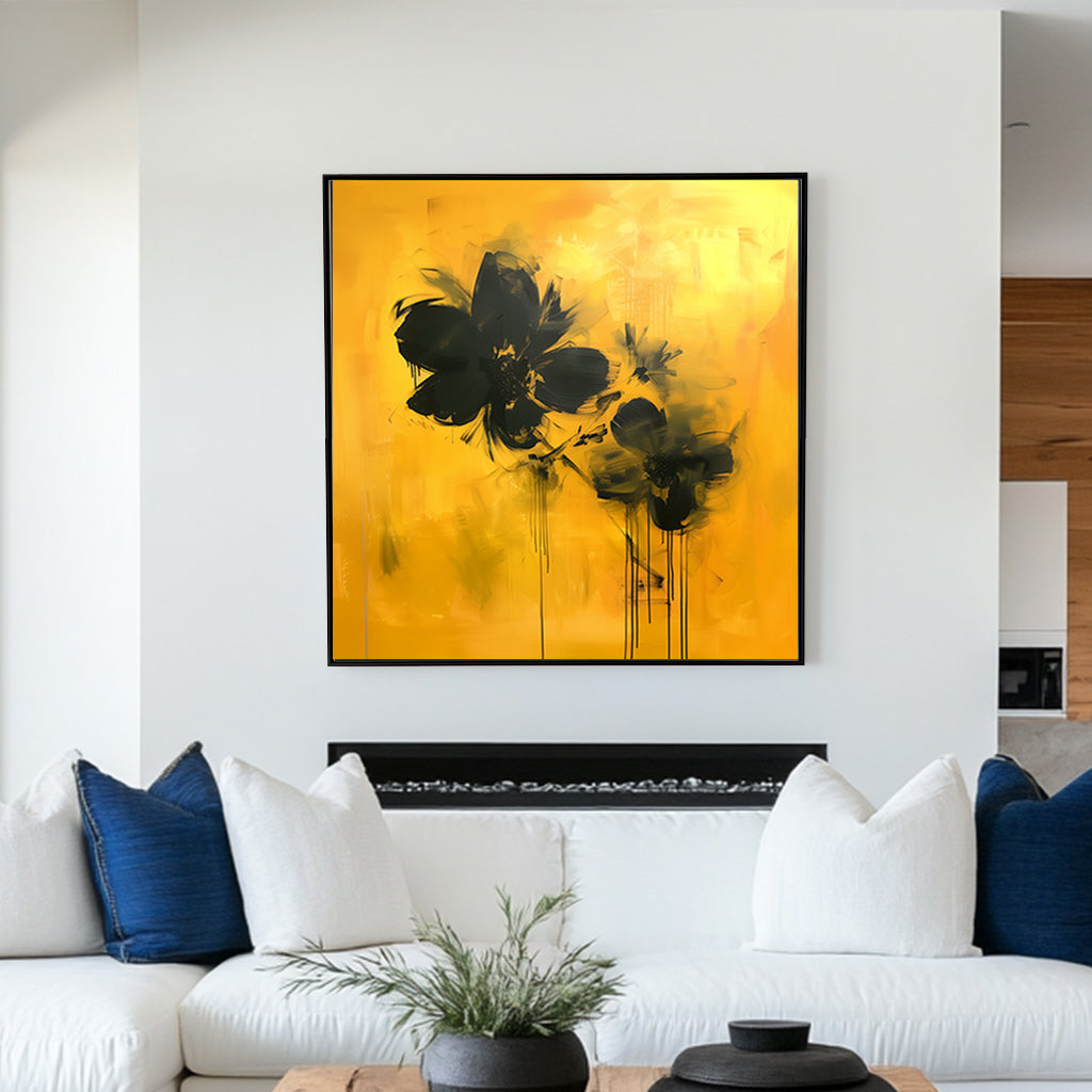 Abstract floral wall artwork featuring bold black flowers on a vivid yellow background with textured brushstrokes and dripping accents.