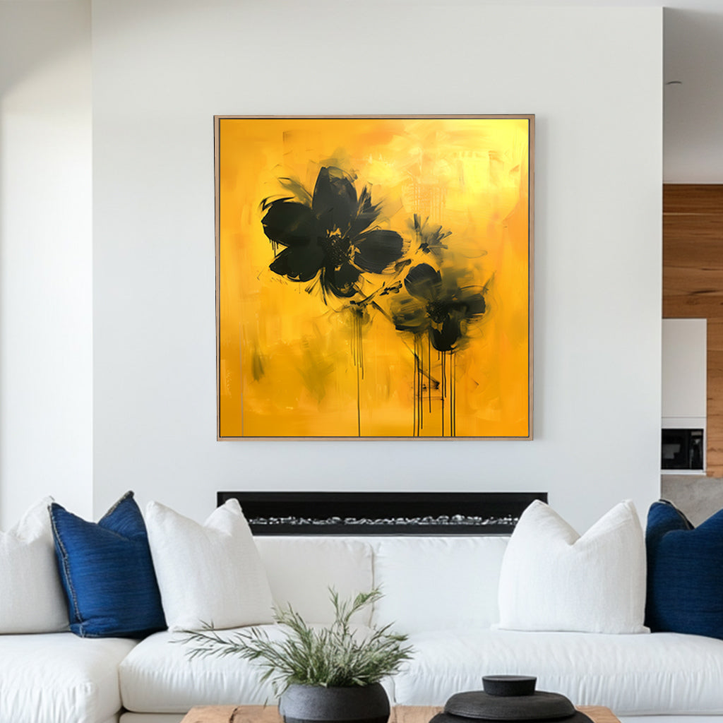 Abstract floral wall artwork featuring bold black flowers on a vivid yellow background with textured brushstrokes and dripping accents.