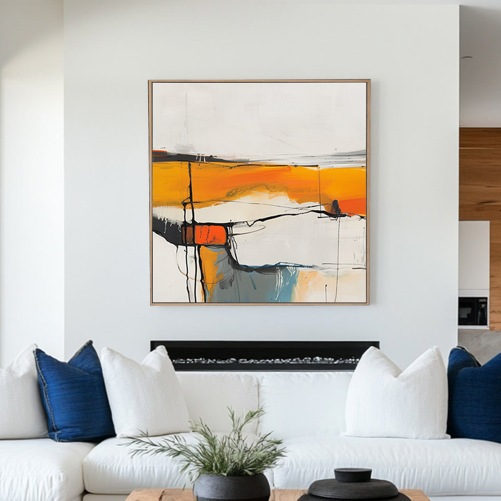 Abstract wall artwork featuring bright white spaces, orange and yellow bands, and soft blue highlights intersected by bold black lines.