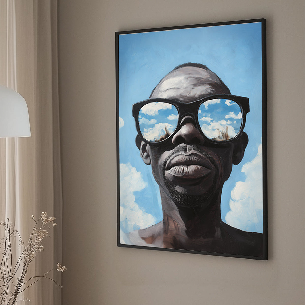 Hyper-realistic wall art print of a surrealism style of a man wearing sunglasses that reflect a vivid blue sky with clouds.
