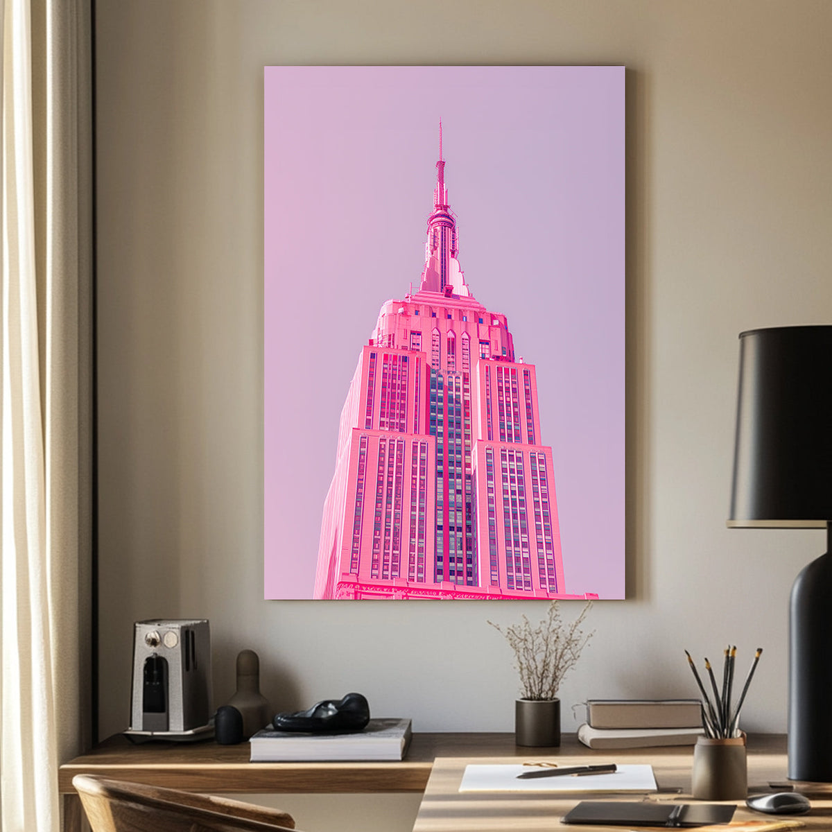A pink wall art print of the Empire State Building in soft pink tones against a pastel background, showcasing minimalistic modern architecture.
