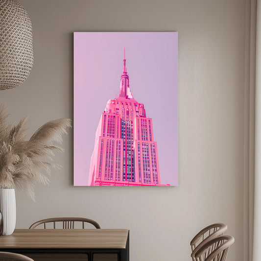 A pink wall art print of the Empire State Building in soft pink tones against a pastel background, showcasing minimalistic modern architecture.