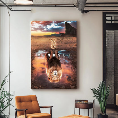 A motivational wall art print of a lion cub looking into a reflection pool, revealing a lion's image, set against a dramatic sunset and savannah landscape.