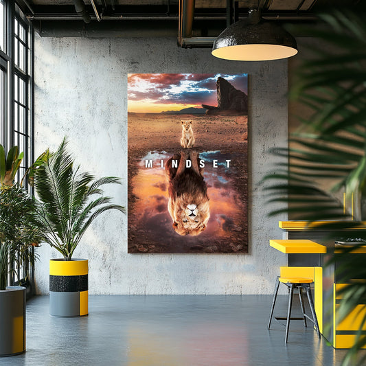 A motivational wall art print of a lion cub looking into a reflection pool, revealing a lion's image, set against a dramatic sunset and savannah landscape.