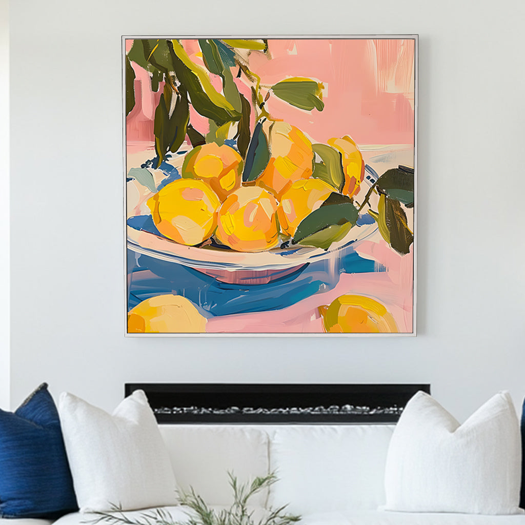 Vibrant still life wall art print of lemons on a blue and white plate, set against a pink background, ideal for adding a splash of freshness and color to home decor.