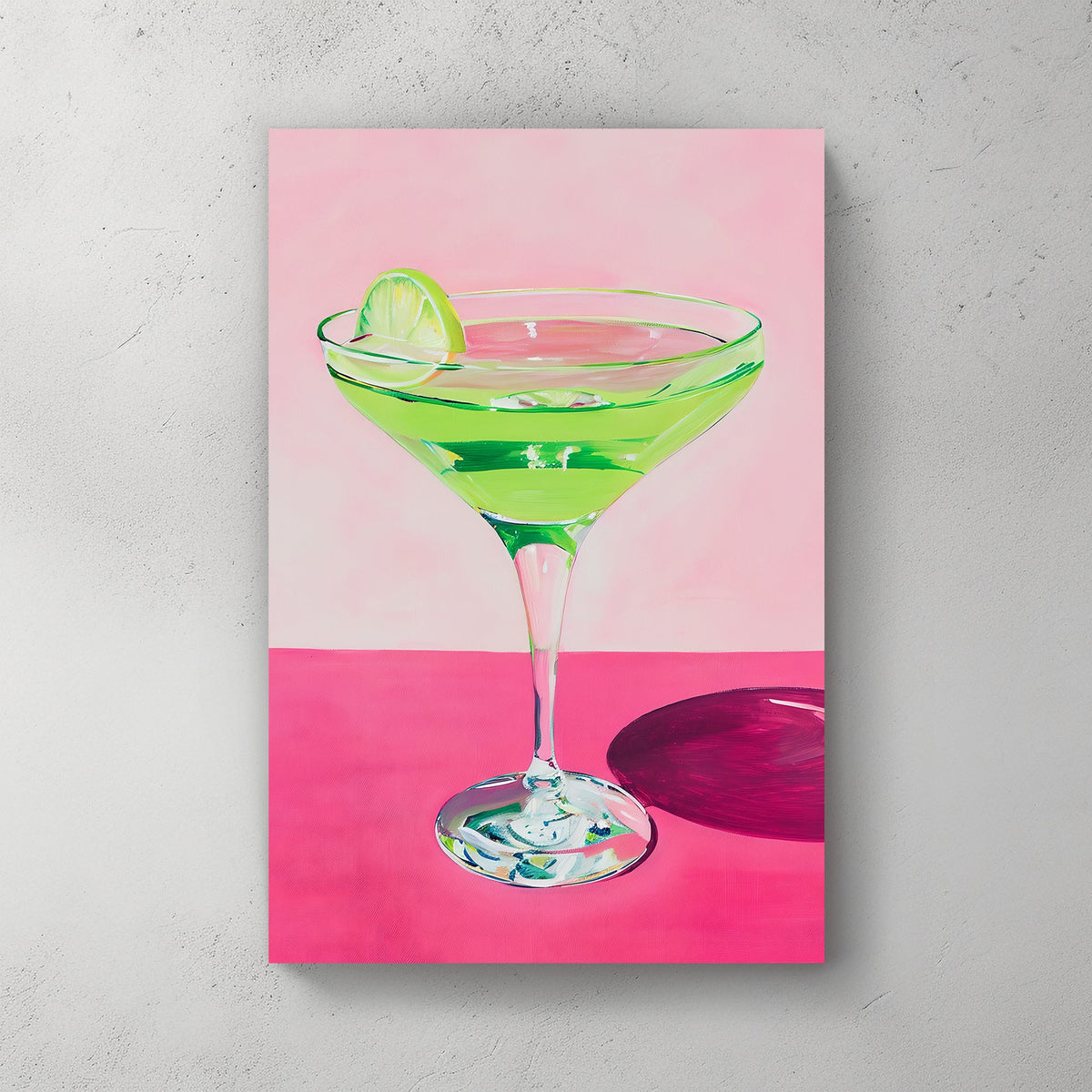Vibrant wall art print of a green cocktail with a lime wedge in a martini glass, set against a pink background, perfect for adding a splash of color and zest to any space.