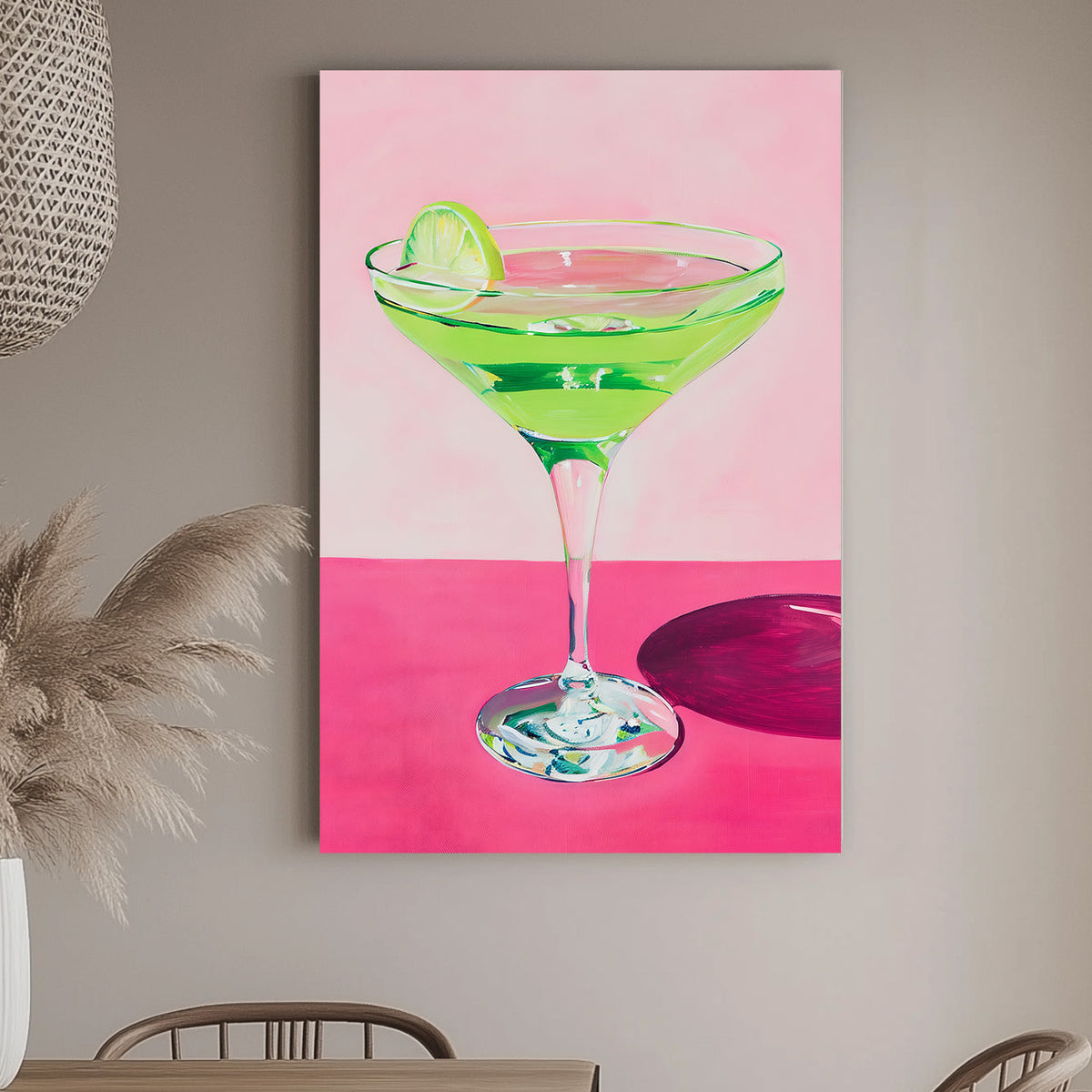 Vibrant wall art print of a green cocktail with a lime wedge in a martini glass, set against a pink background, perfect for adding a splash of color and zest to any space.