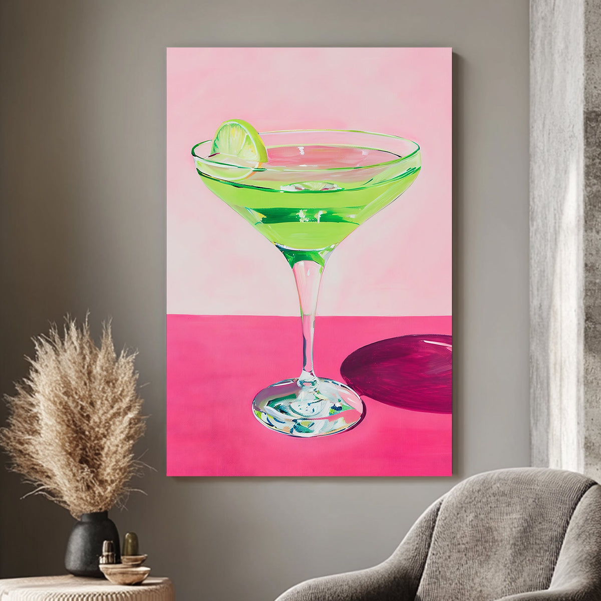 Vibrant wall art print of a green cocktail with a lime wedge in a martini glass, set against a pink background, perfect for adding a splash of color and zest to any space.