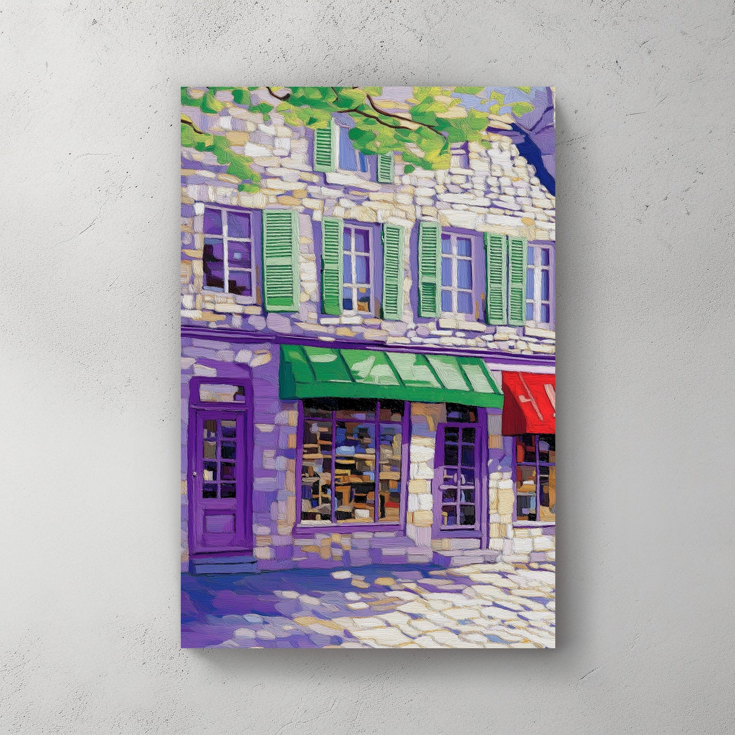 Impressionist-style wall art print of a European street scene with colorful storefronts and stone buildings, under a canopy of lush green leaves.