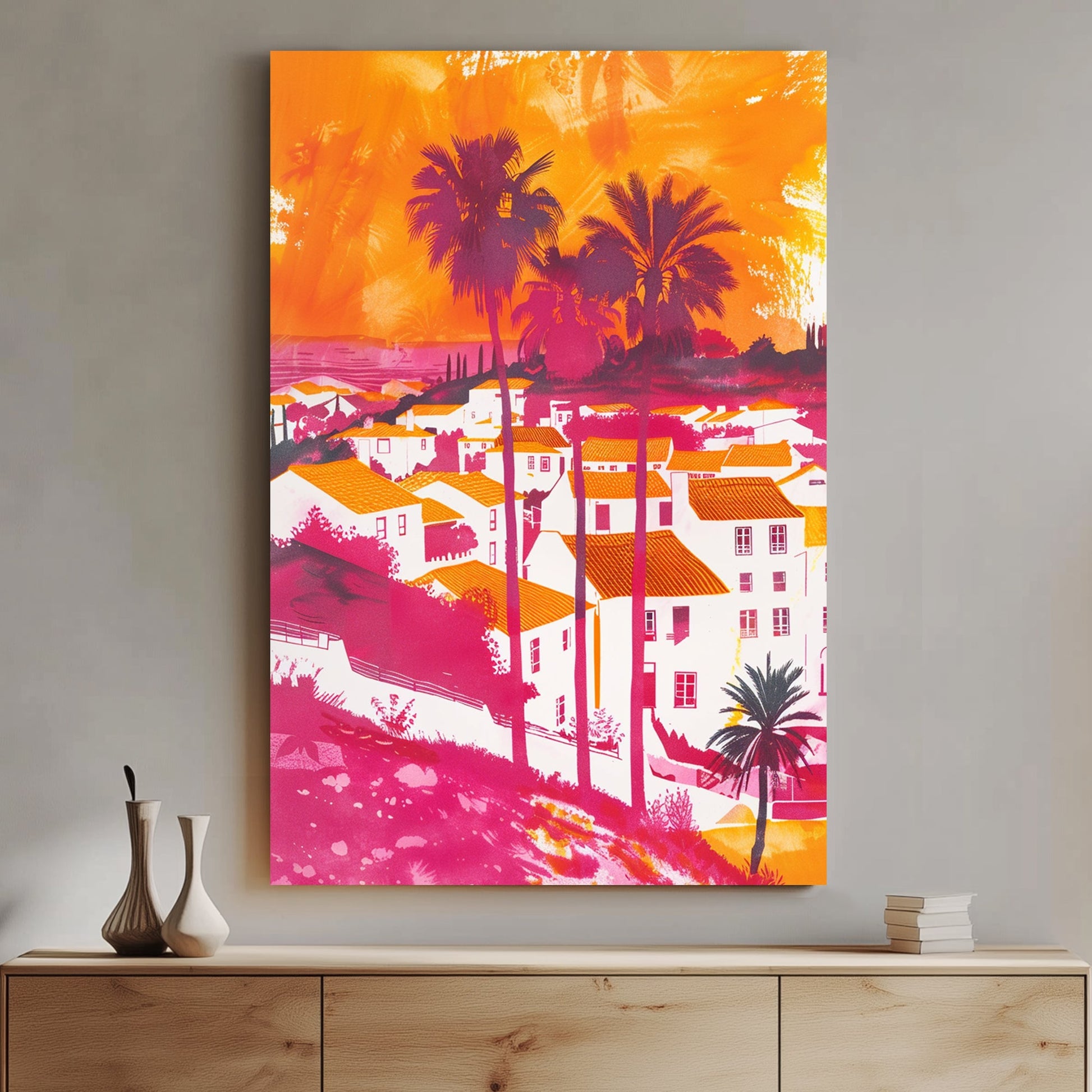 A bold and colourful digital wall art print of a Mediterranean coastal village with palm trees, vibrant orange rooftops, and a pink-hued sunset sky, blending pop art and expressionism.