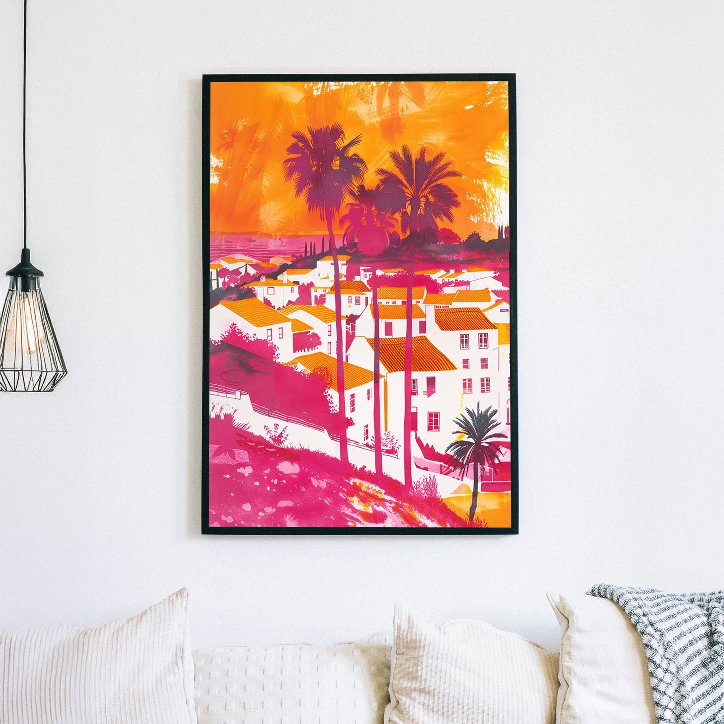 A bold and colourful digital wall art print of a Mediterranean coastal village with palm trees, vibrant orange rooftops, and a pink-hued sunset sky, blending pop art and expressionism.