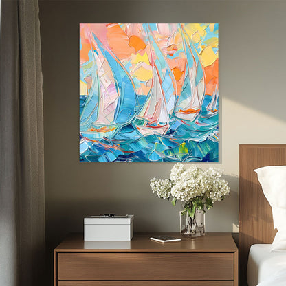 A textured impressionist-style wall art print of sailboats navigating vibrant blue waters under a warm pastel-hued sunset, capturing the movement of the ocean.