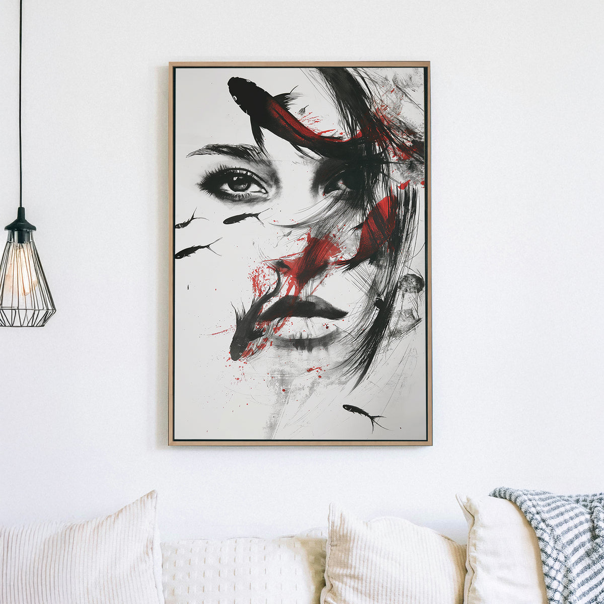 A surreal black-and-white mixed-media wall art print of a woman with flowing ink strokes and koi fish swimming across her face, accented by dramatic red splashes.