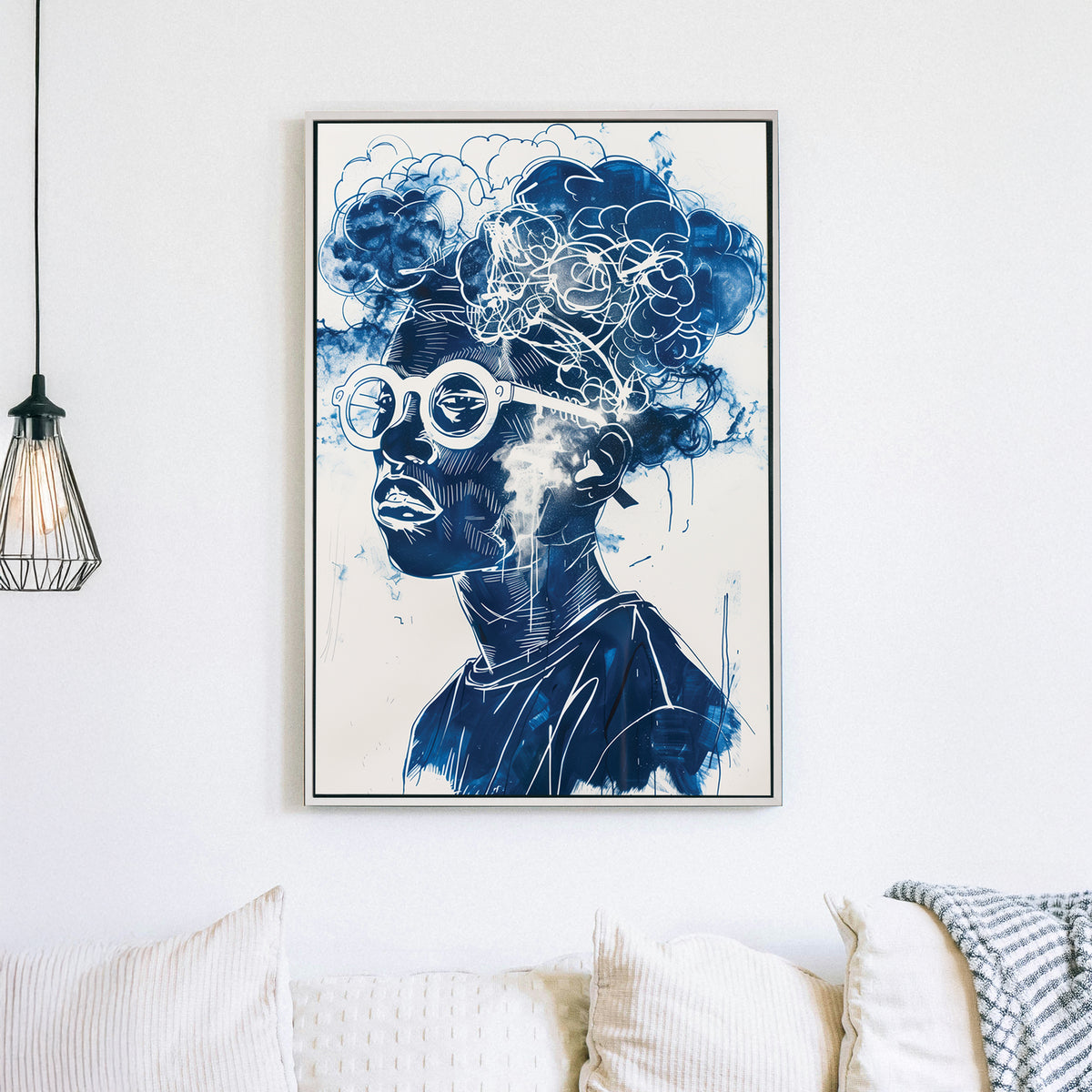 A contemporary graffiti-style wall art print of a person wearing round glasses, with abstract cloud formations seamlessly merging into their hair, rendered in deep blue and white tones.
