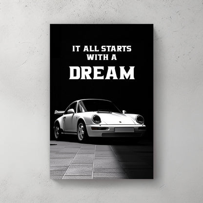 A striking black-and-white digital wall art print featuring a classic white sports car under dramatic lighting, accompanied by the bold motivational quote, “It all starts with a DREAM.”