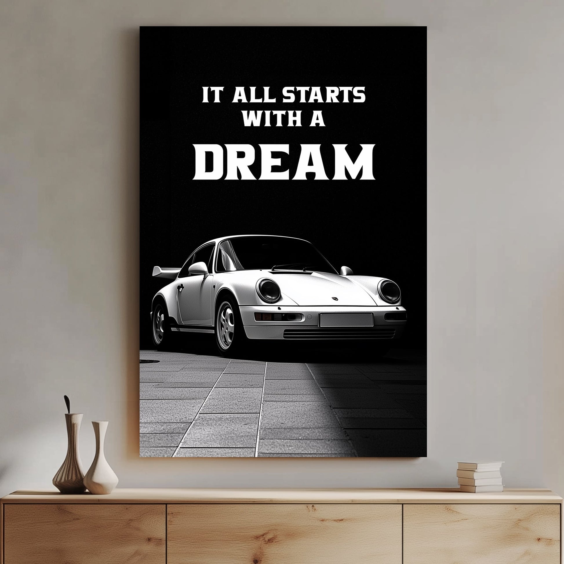 A striking black-and-white digital wall art print featuring a classic white sports car under dramatic lighting, accompanied by the bold motivational quote, “It all starts with a DREAM.”