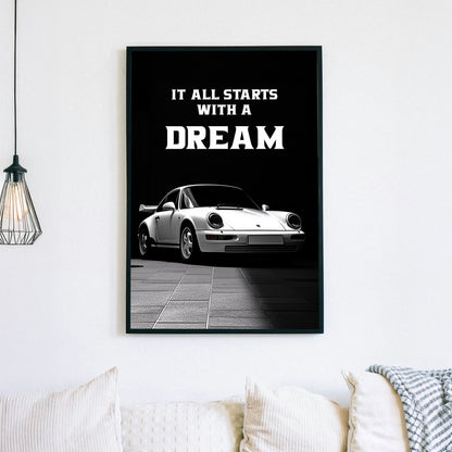 A striking black-and-white digital wall art print featuring a classic white sports car under dramatic lighting, accompanied by the bold motivational quote, “It all starts with a DREAM.”