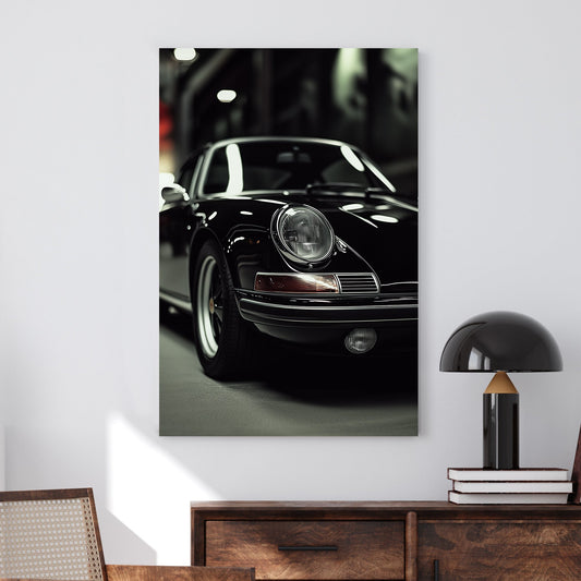 A sleek black-and-white digital wall art print featuring a classic luxury sports car under dramatic lighting, emphasizing its elegant curves and timeless design.