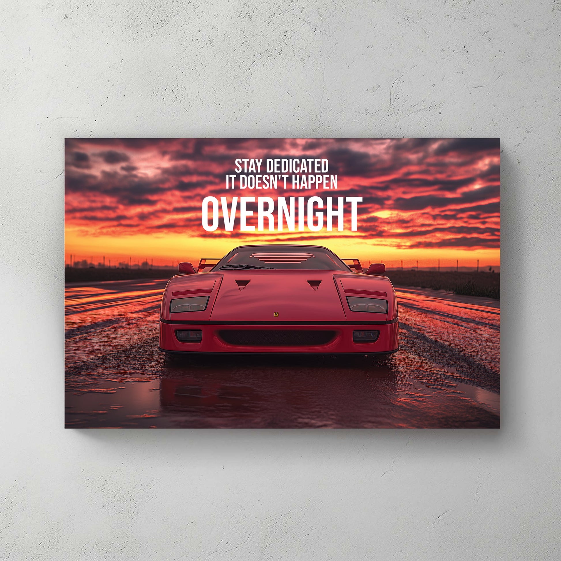 A bold digital wall art print of a red Ferrari F40 facing forward under a dramatic sunset, with motivational typography emphasizing dedication and perseverance.