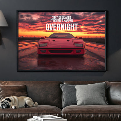 A bold digital wall art print of a red Ferrari F40 facing forward under a dramatic sunset, with motivational typography emphasizing dedication and perseverance.