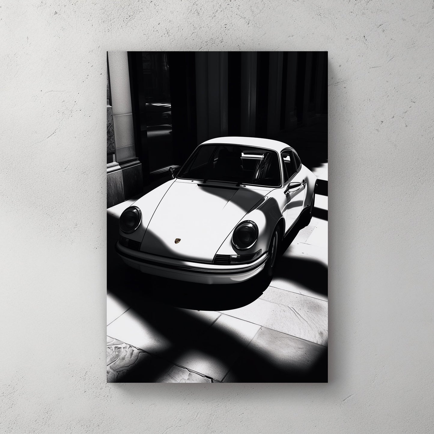 A striking black and white digital wall art print of a classic Porsche 911, captured in dramatic light and shadow, emphasizing its sleek design