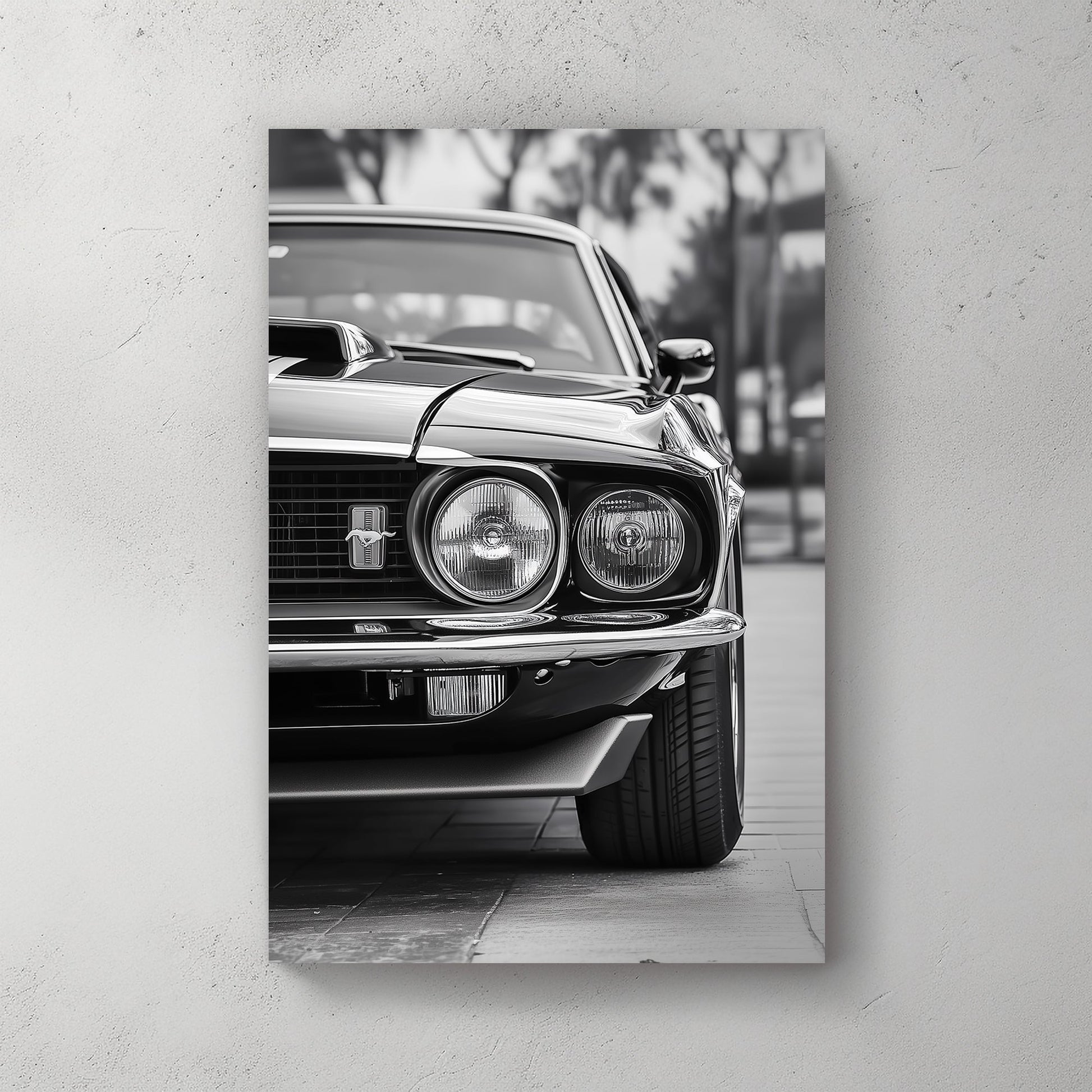 A striking black and white close-up of a classic Ford Mustang front grille and headlights, emphasizing vintage muscle car elegance and power.