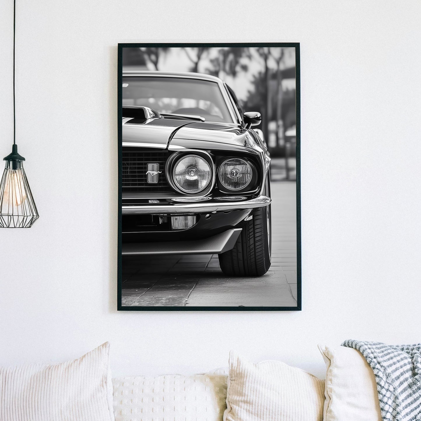 A striking black and white close-up of a classic Ford Mustang front grille and headlights, emphasizing vintage muscle car elegance and power.