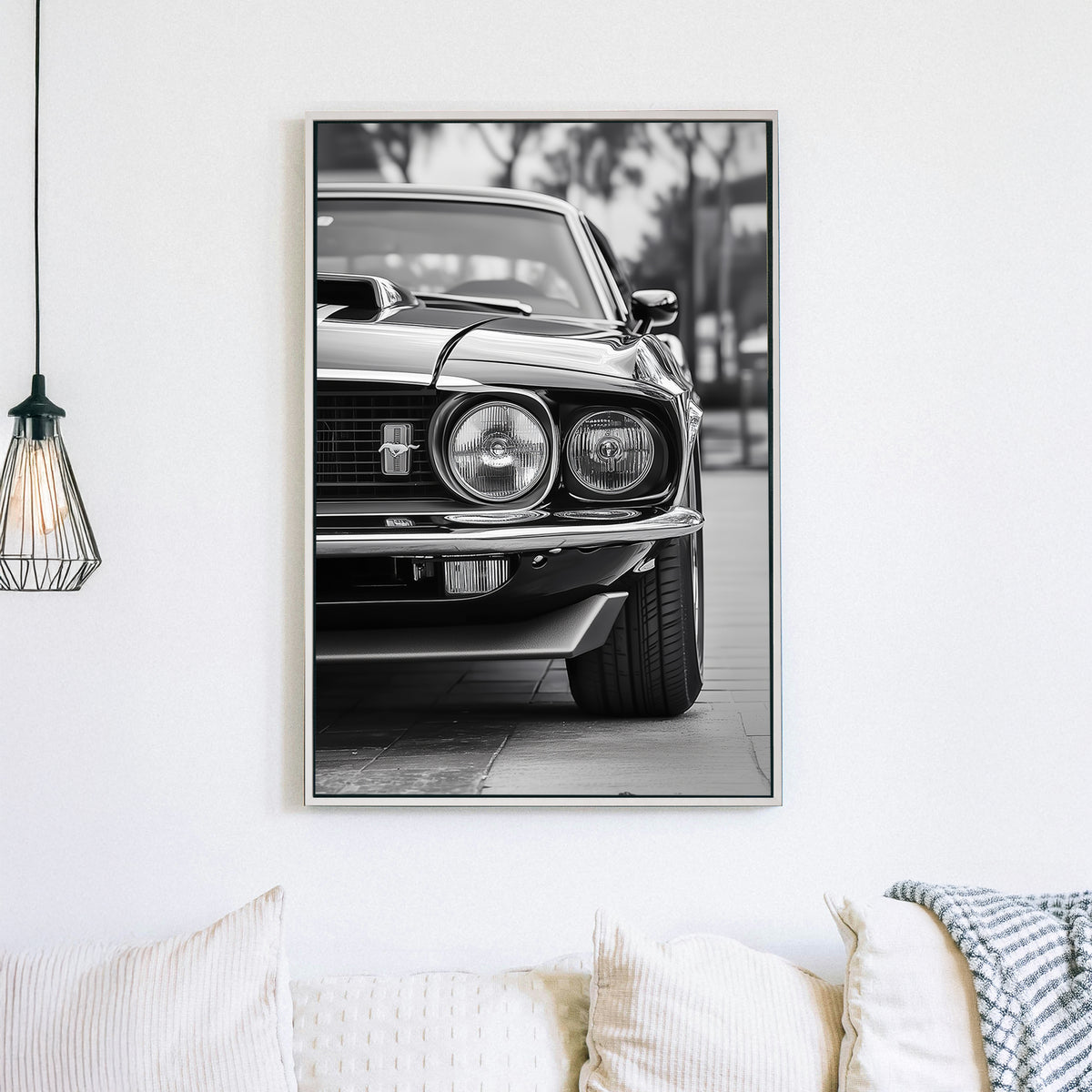 A striking black and white close-up of a classic Ford Mustang front grille and headlights, emphasizing vintage muscle car elegance and power.