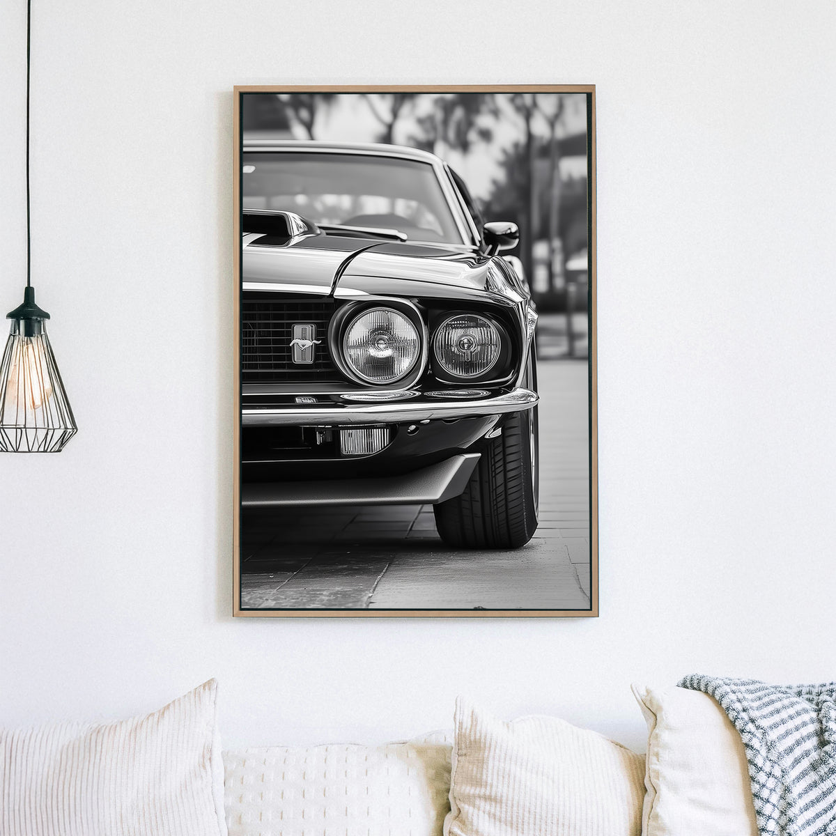 A striking black and white close-up of a classic Ford Mustang front grille and headlights, emphasizing vintage muscle car elegance and power.
