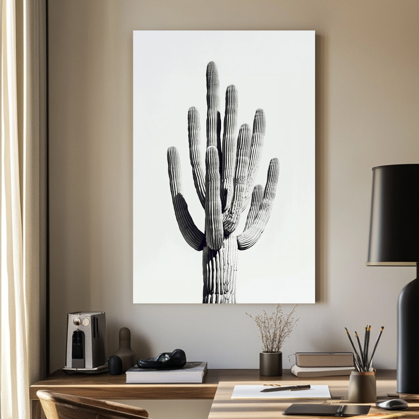 A black and white minimalistic wall art print of a towering saguaro cactus, highlighting its texture and natural elegance against a clean backdrop