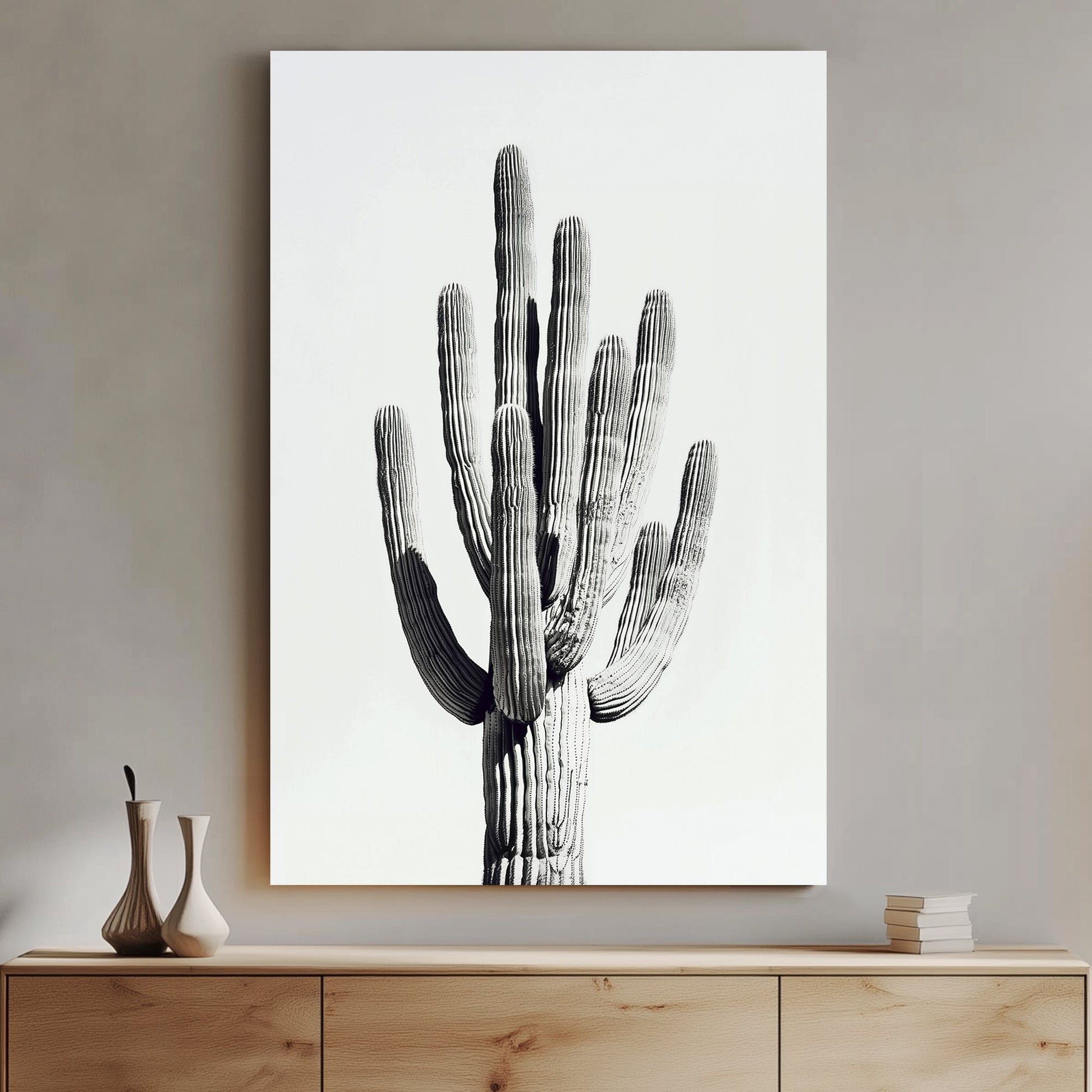 A black and white minimalistic wall art print of a towering saguaro cactus, highlighting its texture and natural elegance against a clean backdrop