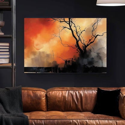 A dramatic abstract wall art print featuring a lone black tree silhouette against a fiery orange and smoky black background, evoking themes of resilience and transformation