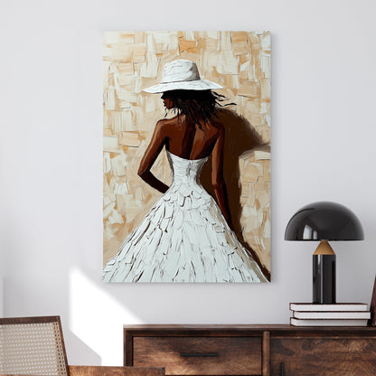 A textured impressionist wall art print of a woman in a flowing white dress and wide-brimmed hat, set against a neutral beige-toned background