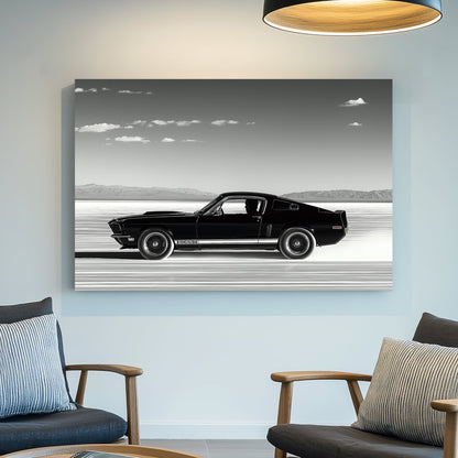 A black-and-white wall art print of a classic Ford Mustang speeding across the salt flats, with a vast open sky and distant mountains in the background.