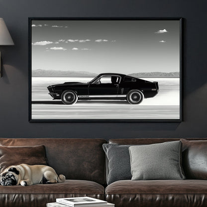 A black-and-white wall art print of a classic Ford Mustang speeding across the salt flats, with a vast open sky and distant mountains in the background.