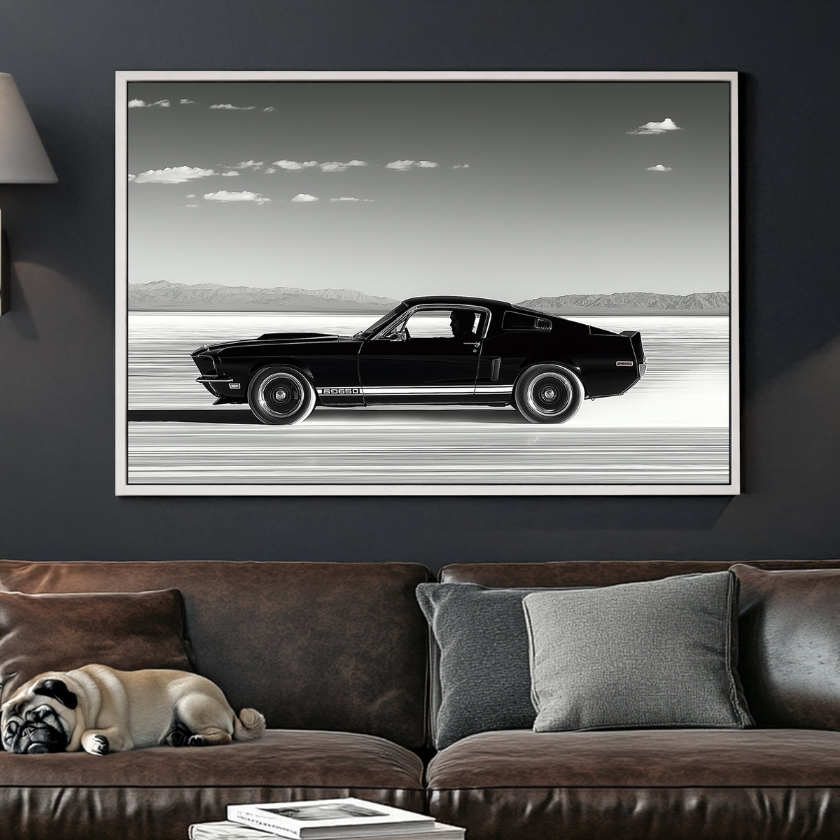 A black-and-white wall art print of a classic Ford Mustang speeding across the salt flats, with a vast open sky and distant mountains in the background.