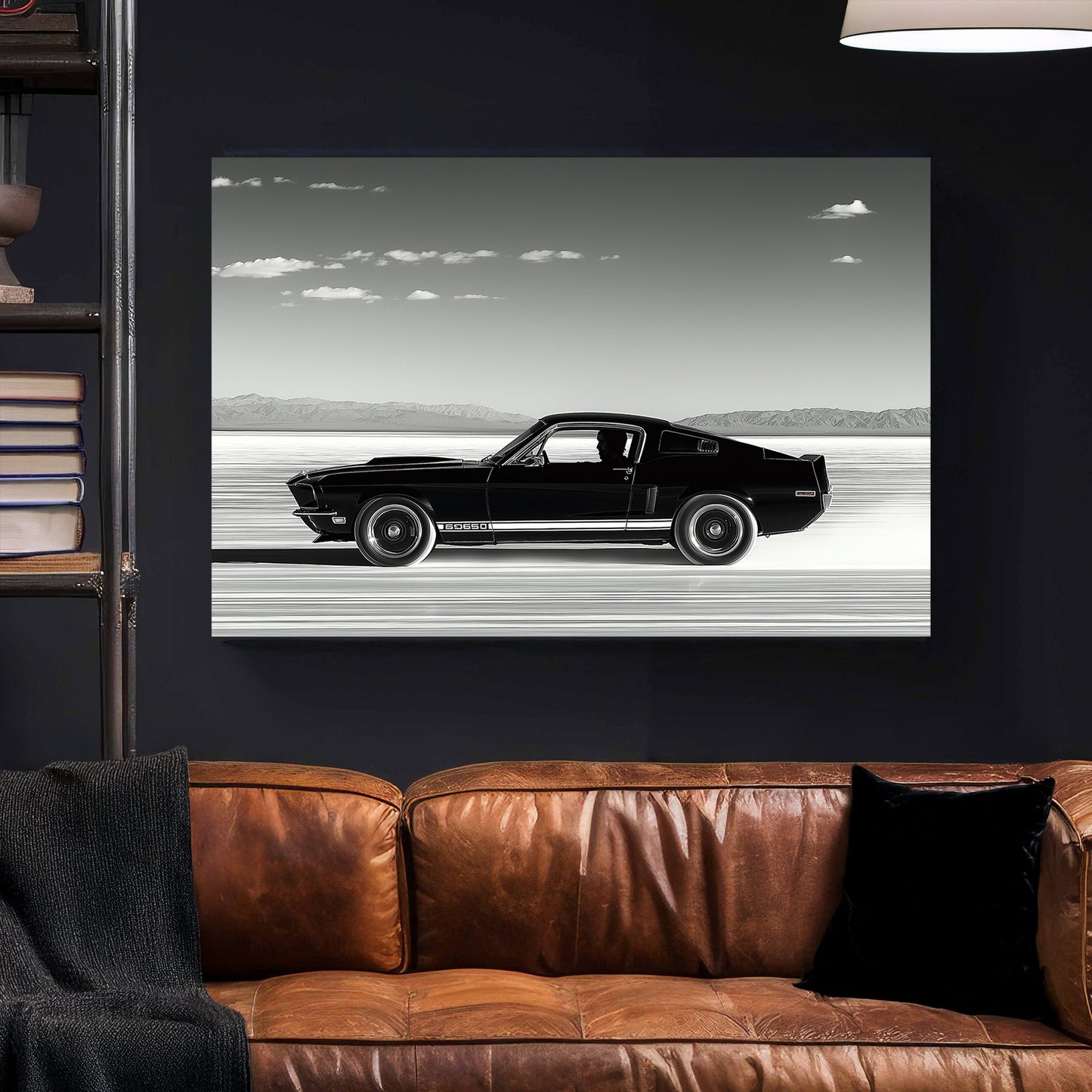 A black-and-white wall art print of a classic Ford Mustang speeding across the salt flats, with a vast open sky and distant mountains in the background.