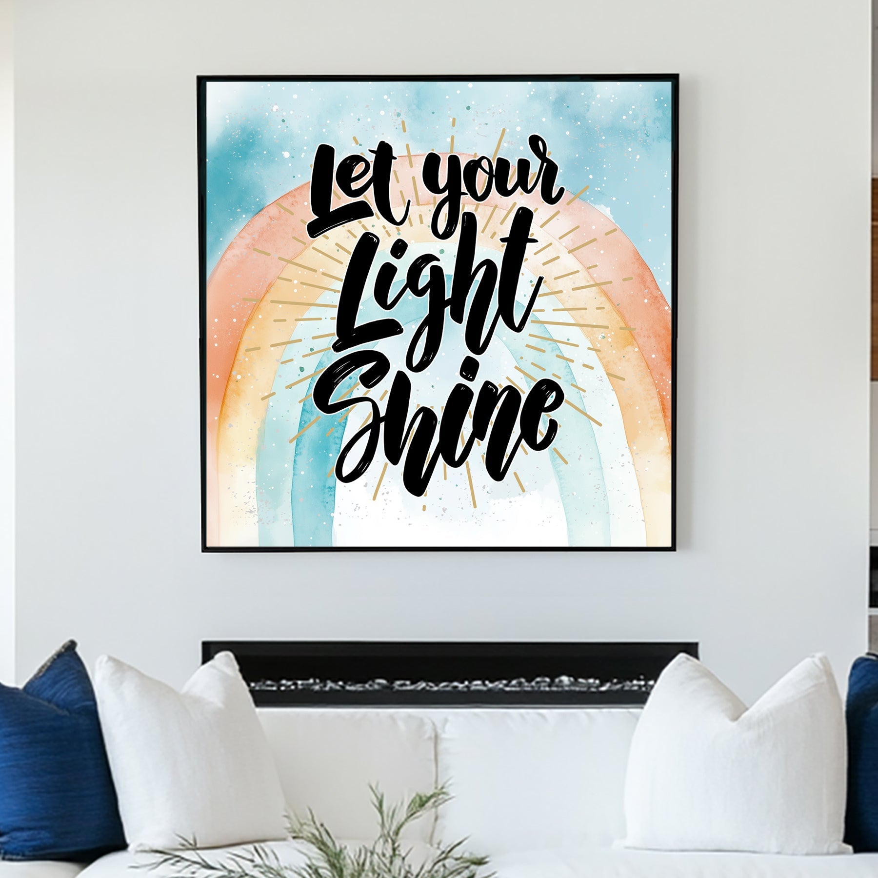 A motivational typography wall art print with the phrase “Let Your Light Shine” in bold script, set against a pastel watercolour rainbow with golden rays.