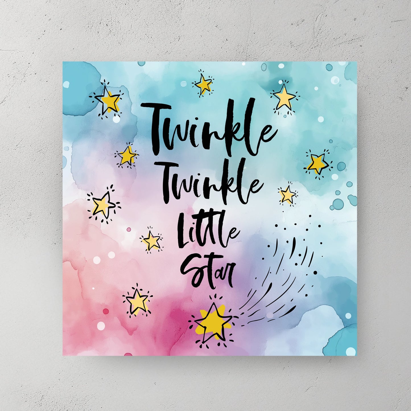 A dreamy watercolour typography wall art print featuring “Twinkle Twinkle Little Star” in elegant script, surrounded by golden stars on a soft pastel blue and pink background.